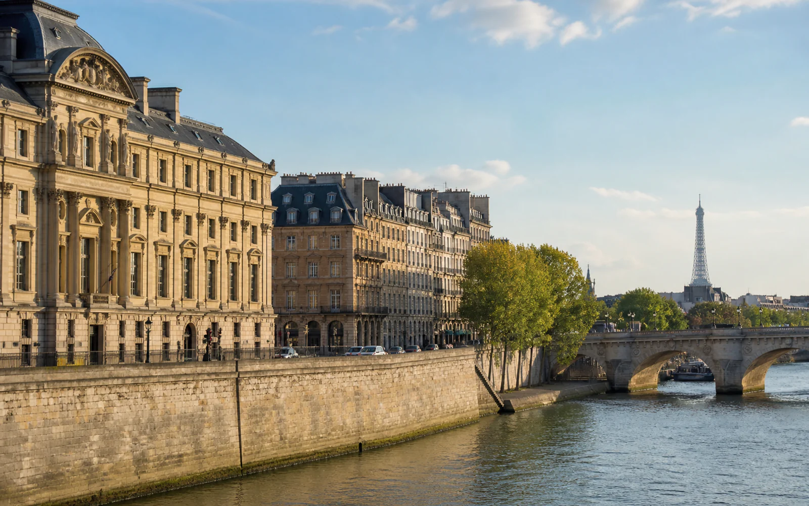 Paris architecture along the Seine with the Eiffel Tower in the distance