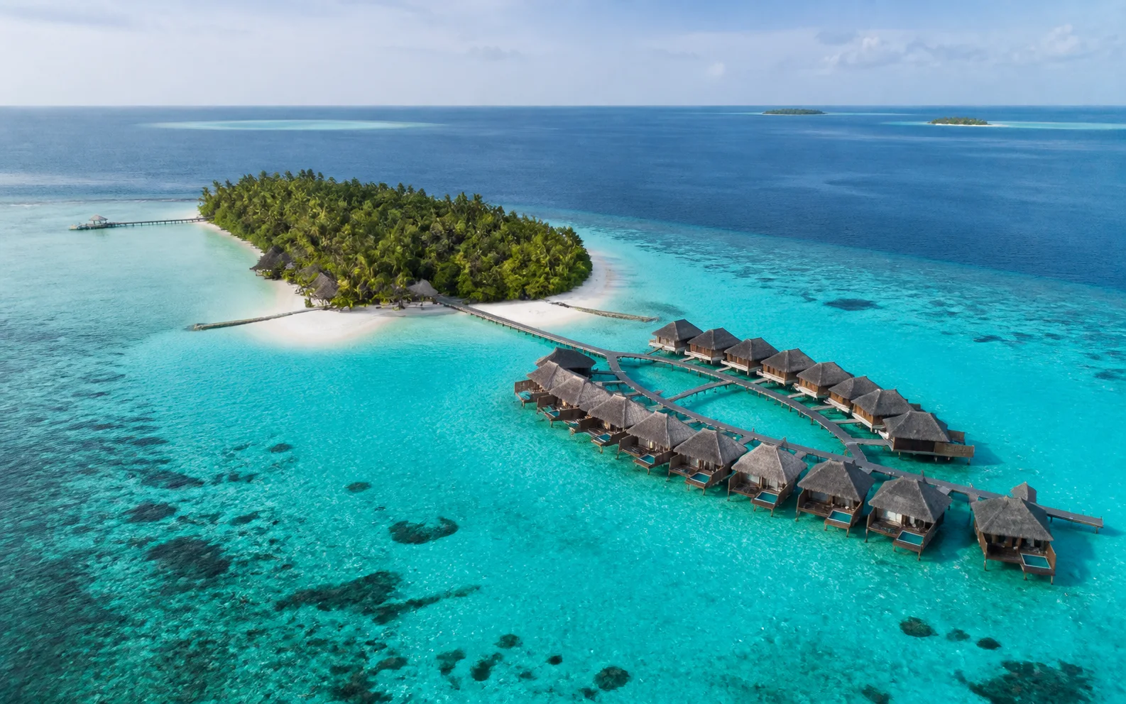 Overwater villas and atoll lagoon in North Malé Atoll